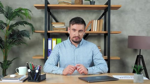 Man in Office Setting Working at Desk
