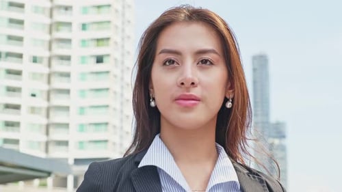 Asian young smart businesswoman working in company office, stand outdoor in city with smiling face