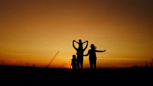 Family with Dog Run at Sunset