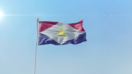 Saba Flag Waving on Flagpole Against Blue Sky