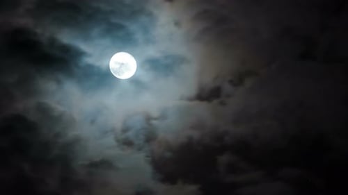 Ethereal Moon and Cloudscape at Night