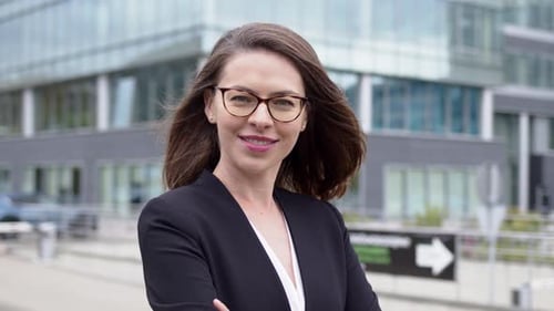Smart Business Woman Standing Over Modern Building.