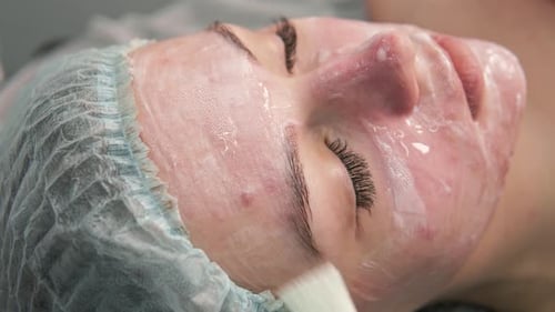 Creamy Facial Treatment for a Relaxed Young Woman
