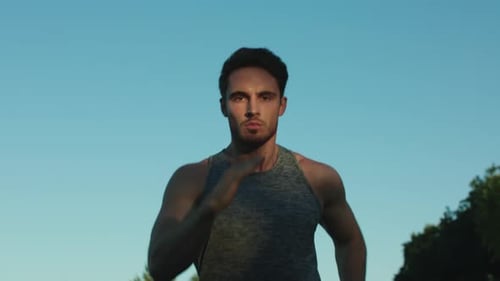 Male Runner Training Cardio Exercise in Park