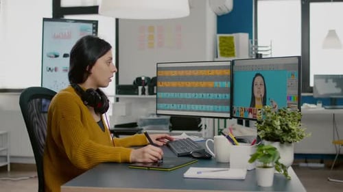 Woman Using Stylus and Tablet in Modern Office