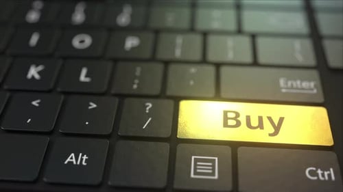 Black Computer Keyboard and Gold Buy Key