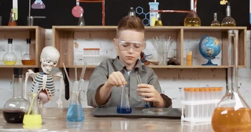 Young Child Doing Science Experiment in Home Laboratory