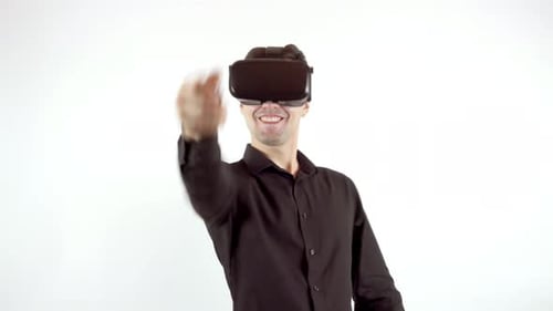 Man Uses Virtual Reality Headset and Controller