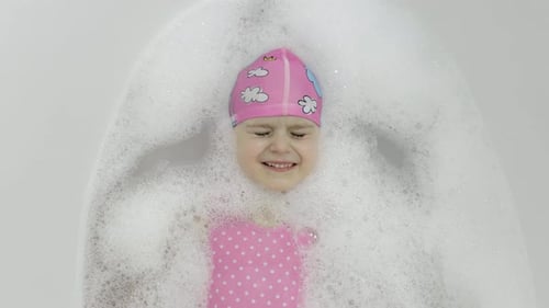 Child Laughing in a Bubble Bath