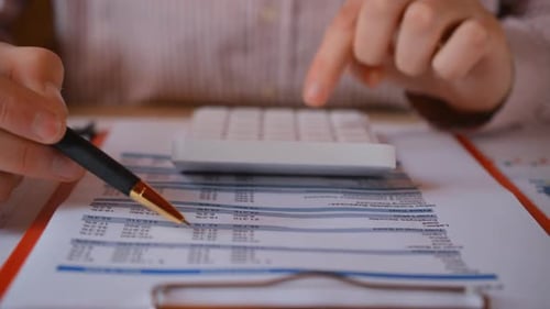 Businessman Working at Office and Calculating Finance Report