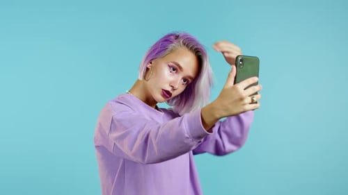 Woman with Purple Hair Posing for Selfie