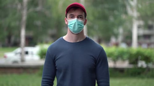 Young Adult Wearing Surgical Mask Outdoors