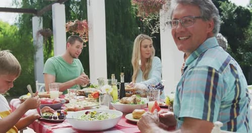 Family and Friends Enjoying Outdoor Lunch Together