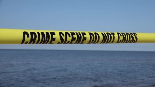 Crime Scene Tape Blocking Ocean Access