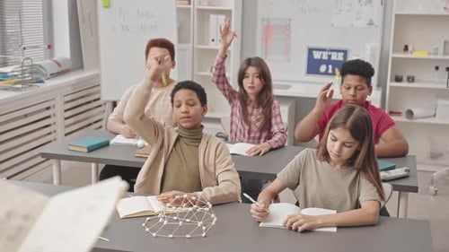 Elementary School Students Answering Questions in Classroom