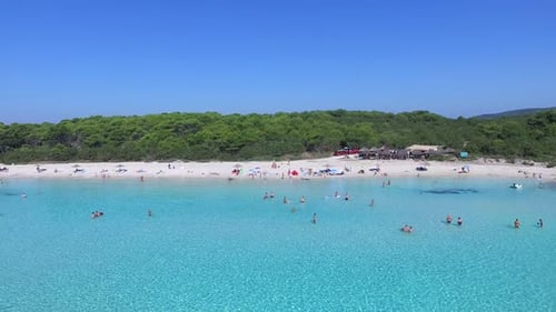Flying over clear blue mediterranean bay