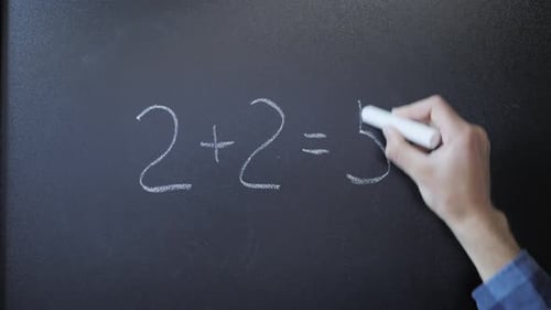 Hand Writes Incorrect Math Equation on Chalkboard