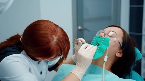Dentist Examining Patient in Modern Clinic