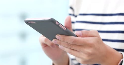 Hands Using Mobile Phone Close Up