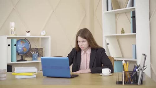 Woman at Laptop Speaking During Online Meeting