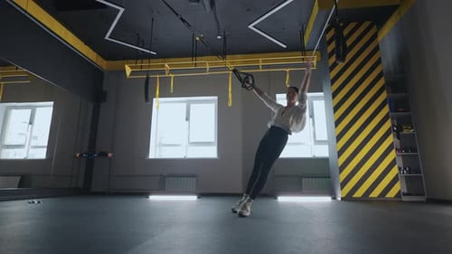 Fitness Woman Workout Exercise with Trx Equipment in the Fitness Gym Healthy Lifestyle Building