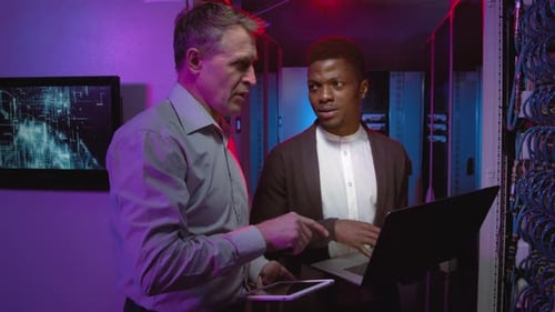 Network Engineers Talking in Data Center