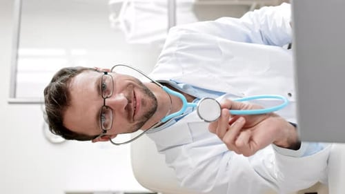 Smiling Doctor Wearing Stethoscope and White Coat