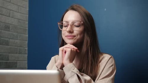 Happy Young Caucasian Woman Communicating By Conference Call Speak Looking at Laptop at Home Office