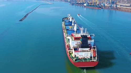 Aerial Top View of Cargo Ship Running with Tug Boat for Export Goods From Cargo Yard Port to Custom