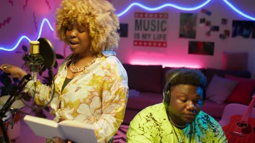 African American Duo Recording Song in Audio Studio