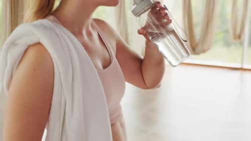 Girl Drinking Water After Yoga