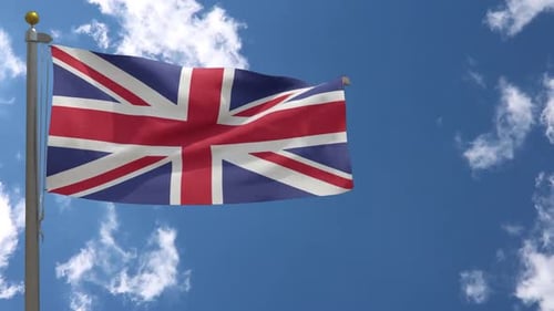 United Kingdom Flag Waving Against Blue Sky