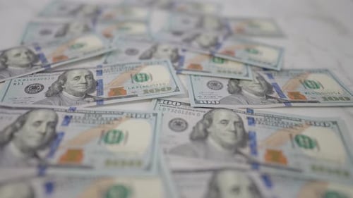 Pile of US Hundred Dollar Bills