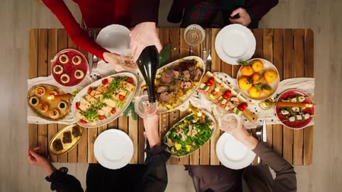 Friends Celebrating New Year Top View Sitting at Dining Table
