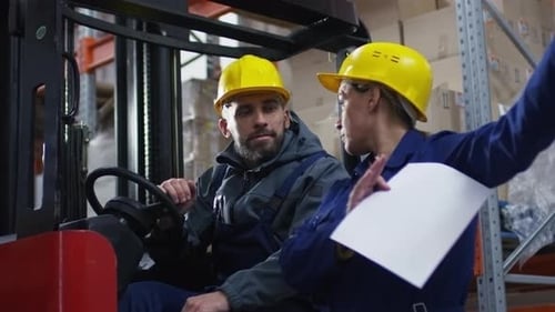 Forklift Operator and Warehouse Manager Talking