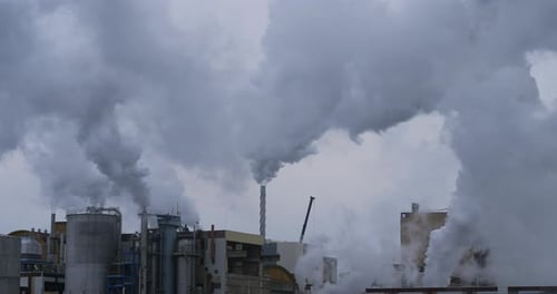 Paper Factory, Tartas, Landes department, France. Water vapor against a grey sky