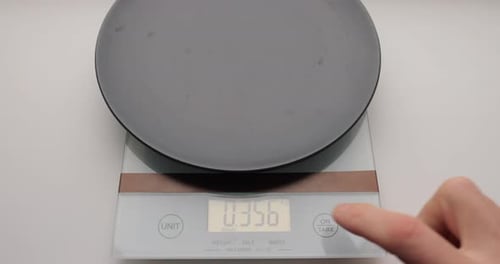 Weighing Coffee Beans on a Kitchen Scale