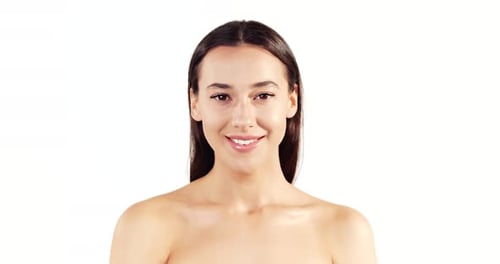 Woman Smiling Against a White Background