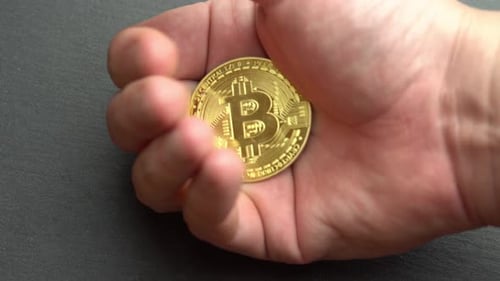 Bitcoin BTC in Hand Cryptocurrency in Palm of Hand Digital Coin Cyberspace Cryptocurrency Background