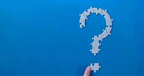 Grey Puzzles Isolated On Blue Background. Social Issue Concept