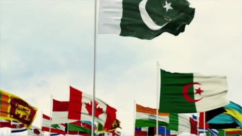 Waving Pakistan Flag with International Flags in Background
