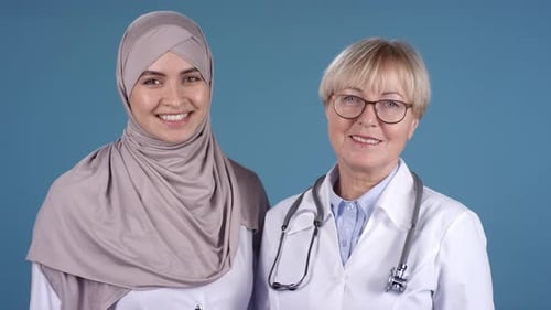 Female Doctors Smiling for Camera