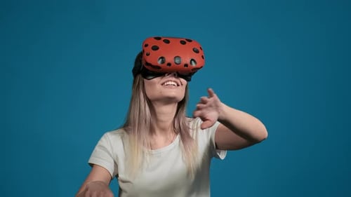 Happy Girl Plays Video Game with Virtual Reality Headset