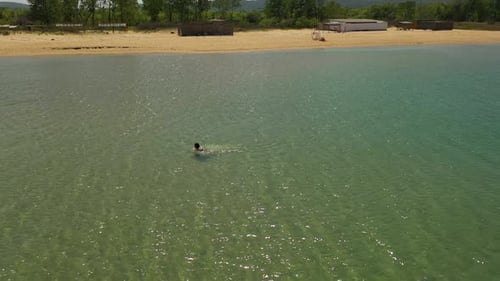 4k Aerial View Of Coastline, Woman start swimming- Black Sea, Gradina, Bulgaria