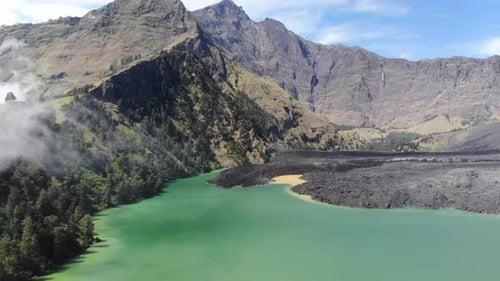 Aerial video of low laying clouds over Mount Rinjani in Indonesia (3)