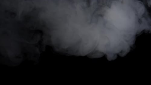 White Smoke Explosion And Spins Around Over Black Background