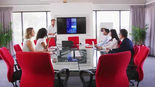 Professional businessman giving presentation in meeting room in modern office in slow motion
