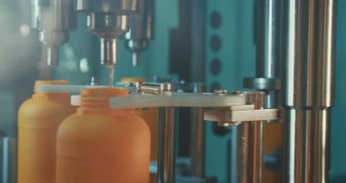 Filling of chemical bottles in a production line