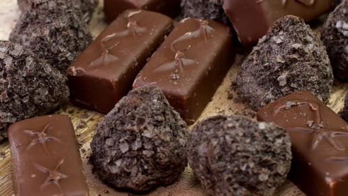 Chocolate Candies and Truffles on Wooden Surface