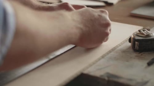 Carpenter Makes Pencil Markings on the Blank with the Help of a Ruler